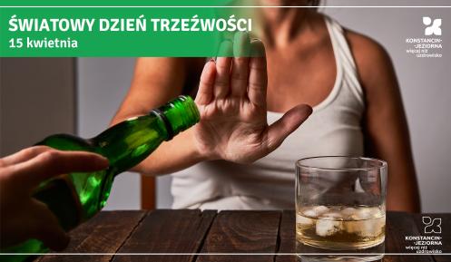 Kobieta gestem dłoni odmawia alkoholu, gdy ktoś próbuje nalać napój z zielonej butelki do szklanki stojącej na stole, na grafice z napisem „Światowy Dzień Trzeźwości – 15 kwietnia”.