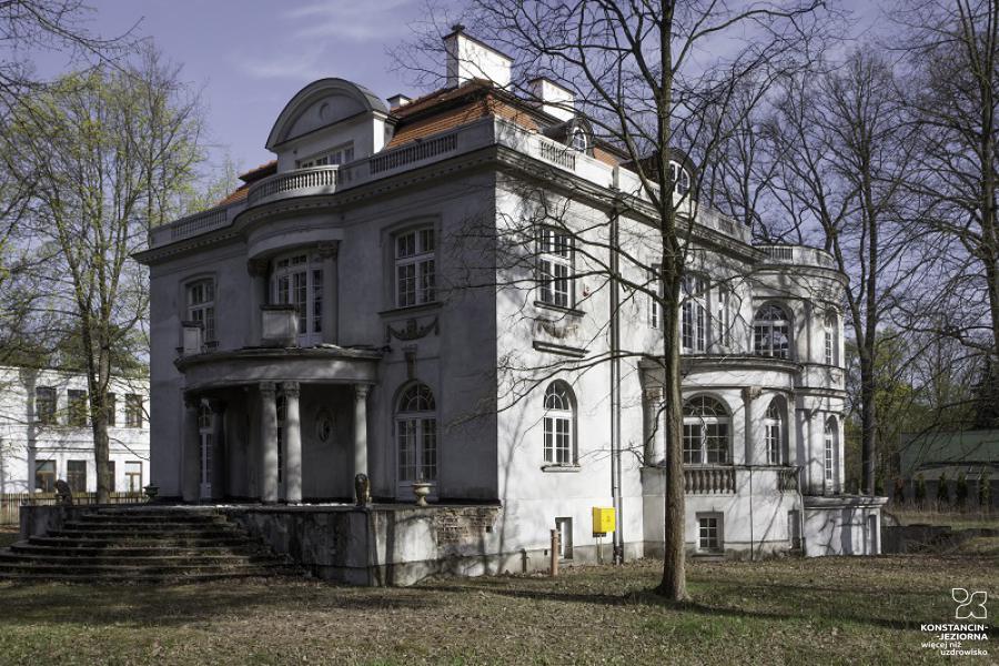 A view from the corner on a two-story building with covered entrances 