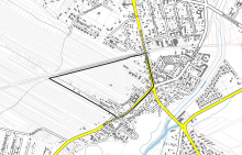 Fragment mapy. Czarną grubą linią, o nieregularnym kształcie, zaznaczono granice obszaru objętego miejscowym planem zagospodarowania przestrzennego.
