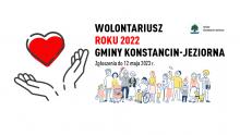 Grafika wektorowa. Serce na dłoni i napis: Wolontariusz Roku 2022 Gminy Konstancin-Jeziorna.