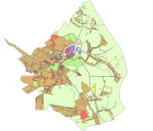Mapa planistyczna gminy przedstawiająca zróżnicowane przeznaczenie terenów w formie kolorowych stref, z dominującą zabudową w części centralnej oraz rozległymi obszarami zielonymi na obrzeżach.
