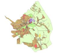 Mapa planistyczna gminy przedstawiająca zróżnicowane przeznaczenie terenów w formie kolorowych stref, z dominującą zabudową w części centralnej oraz rozległymi obszarami zielonymi na obrzeżach.