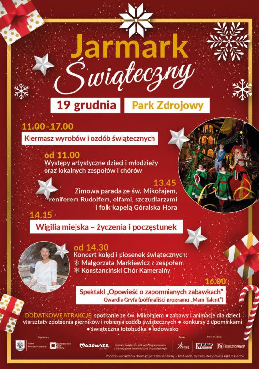Plakat promujący jarmark świąteczny. Czerwone tło z świątecznymi elementami graficznymi (gwiazdki, śnieżynki) na nim dwa zdjęcia – kobiety oraz z parady świątecznej. W głównej części znajdują się szczegółowe informacje dotyczące wydarzenia, które zostały również powielone w artykule.